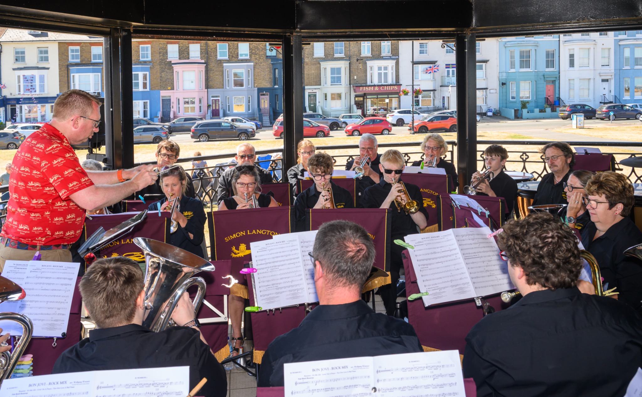 Simon Langton Brass performing at a bandstand