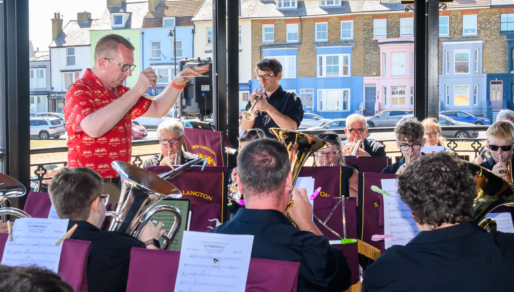 Conductor leading Simon Langton Brass at Deal Bandstand