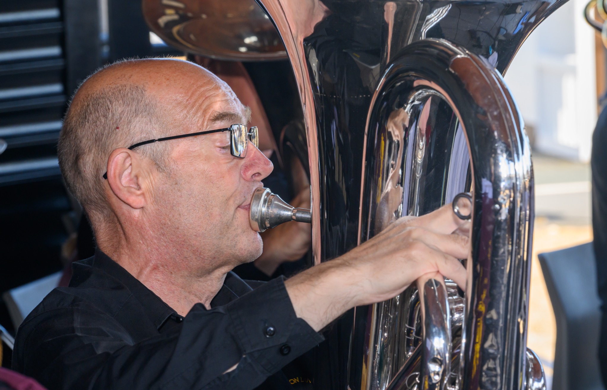 Bass player performing at Deal Bandstand, close-up