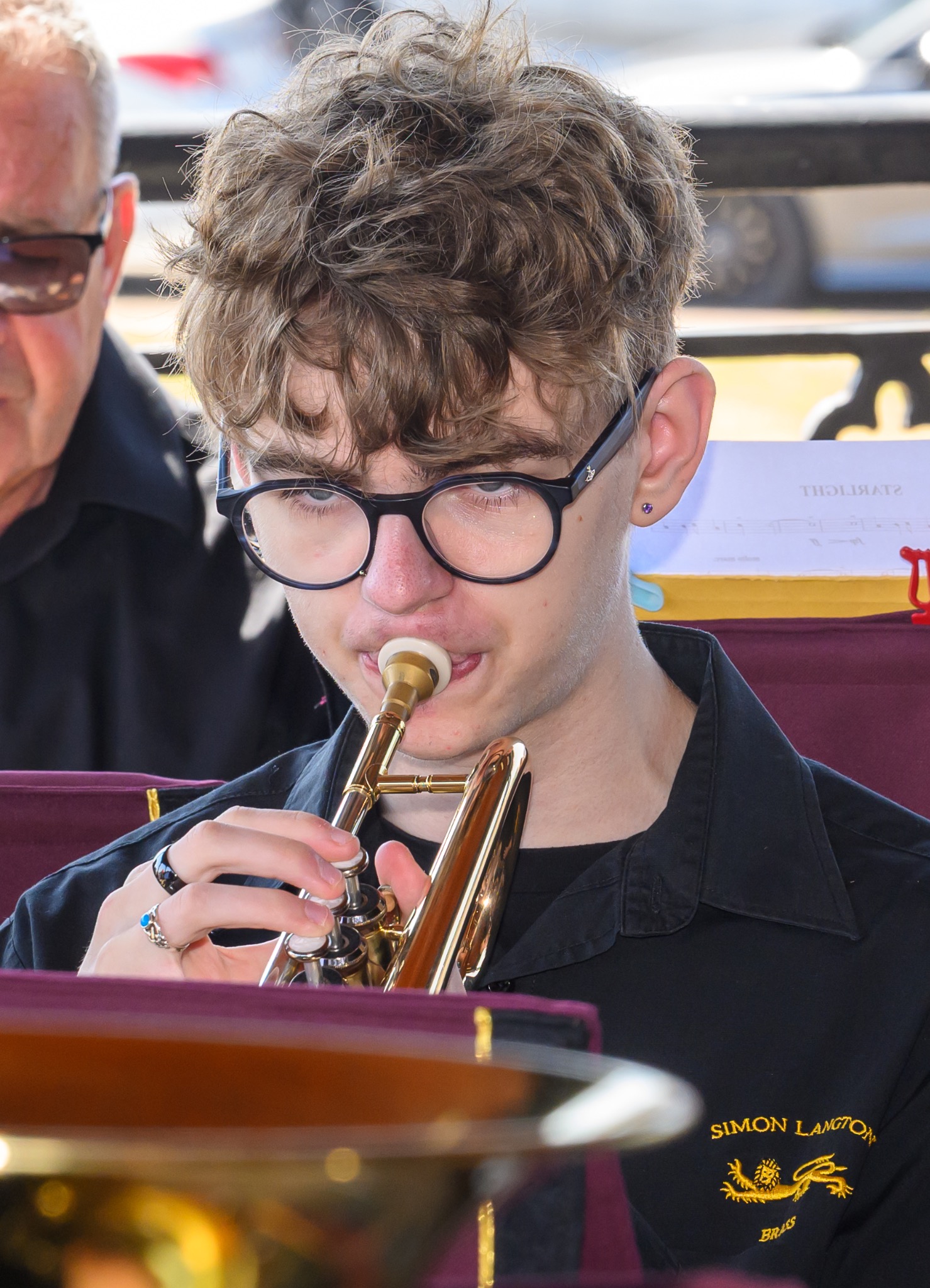 Ben Sutehull playing cornet with Simon Langton Brass at an outdoor performance