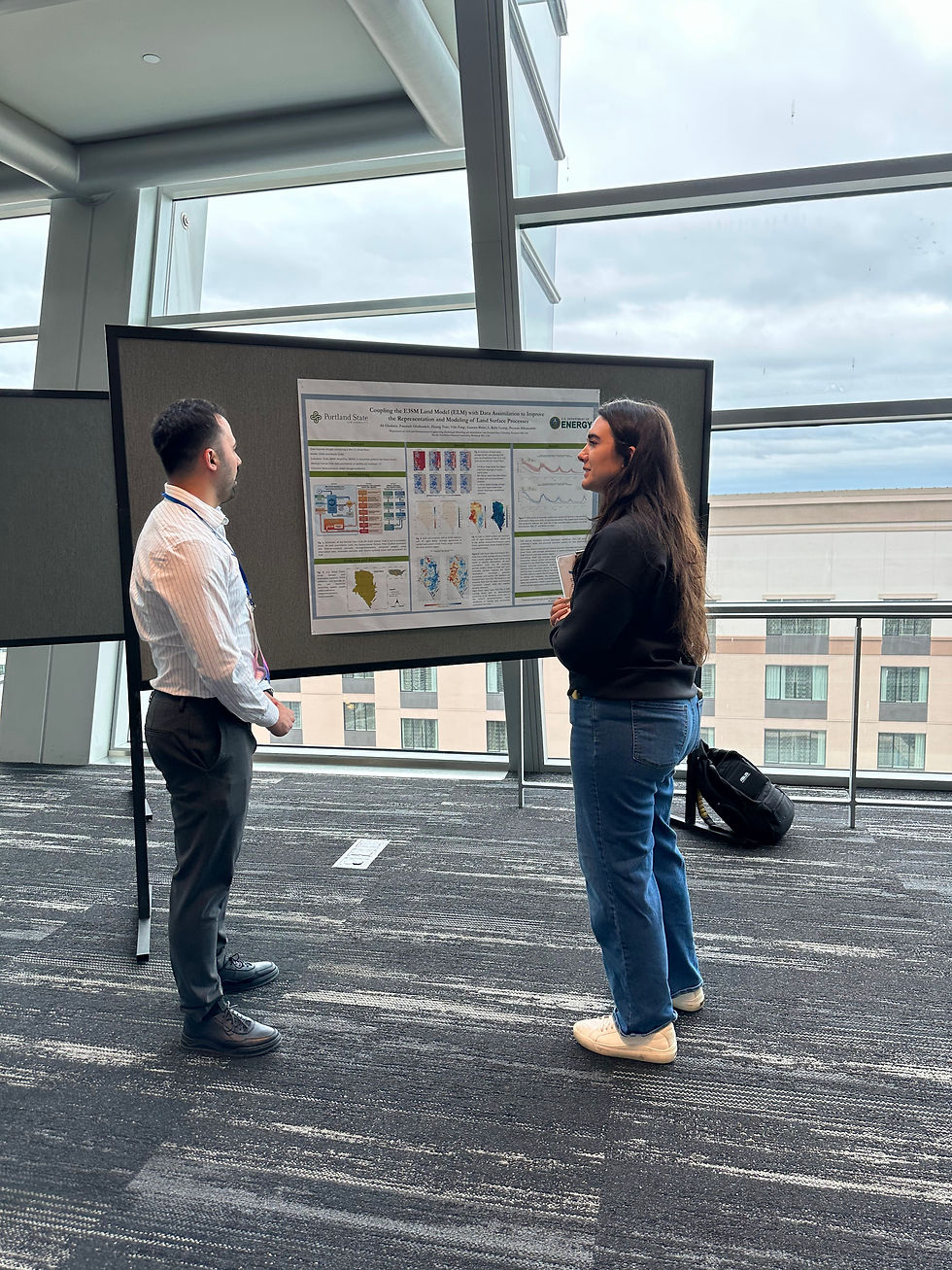 Laura Oxsen listening to a young professional's technical poster presentation at the PNWS-AWWA conference.