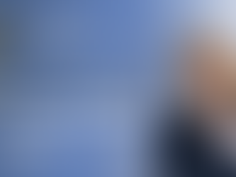 KXAN-TV Austin graphic on Supreme Court tariff ruling, with smiling blonde woman, U.S. flag, and blue law-firm branding