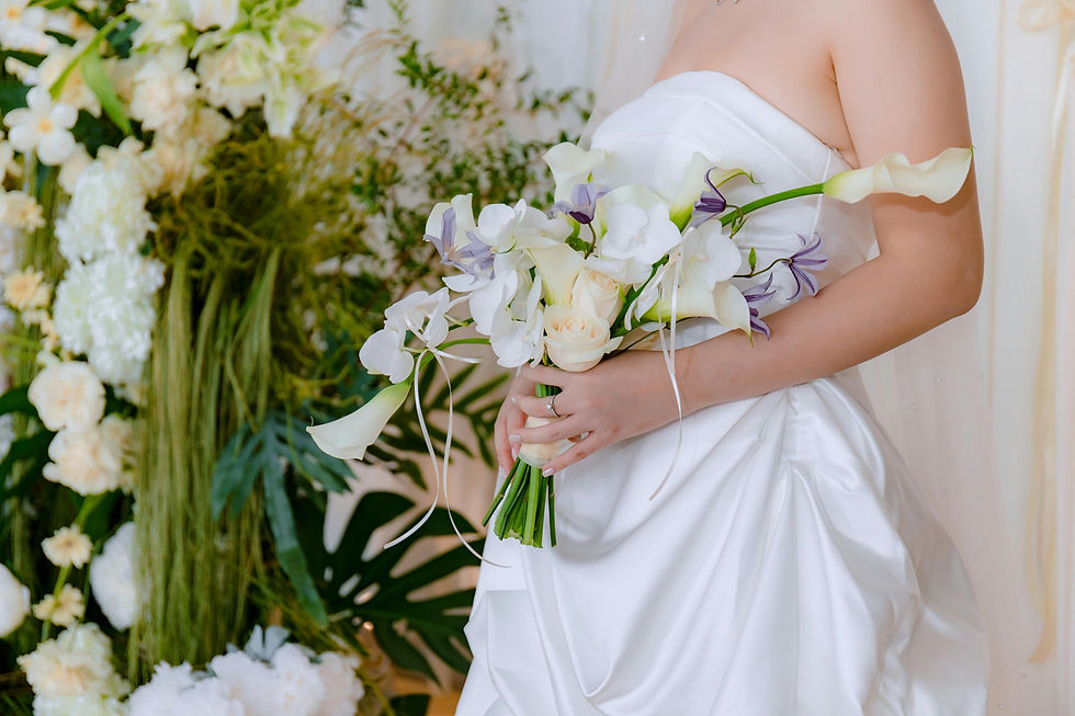 Winter wedding bouquet featuring roses, eucalyptus, and pine accents