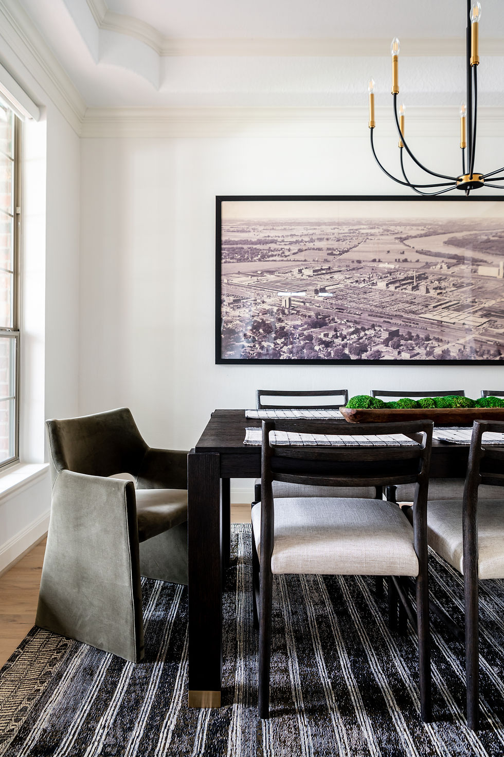 Modern transitional dining room with long black dining table that extends and super sexy baby got back dining chairs in our Humble House whole house renovation project by Houston interior design firm Nancy Lane Interiors.