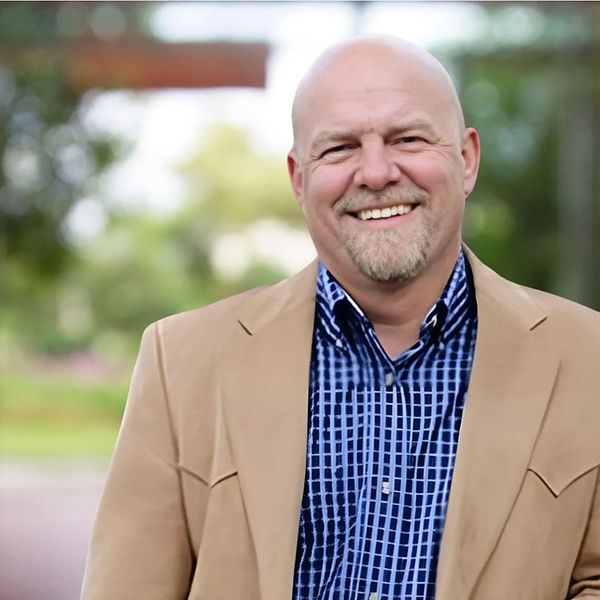 Ira Headshot Tan Jacket_edited.jpg