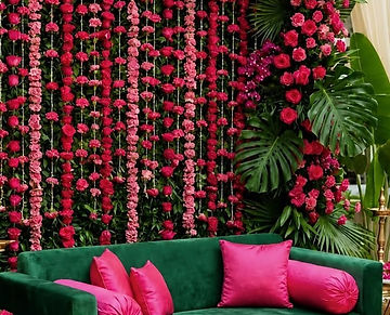 Pink rose and green leaf flower wall for a mehndi function