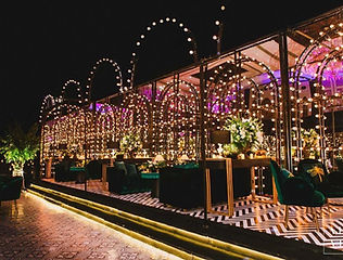 Evening event decoration with coloured lights by Kauvery Events
