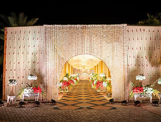 White floral arch stage decoration by Kauvery Events