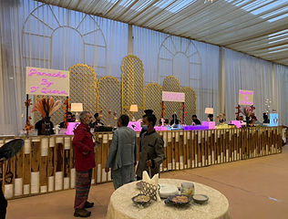 Event venue with decorated dining tables by Kauvery Events