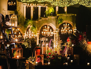 Festive light decoration on a house at night by Kauvery Events