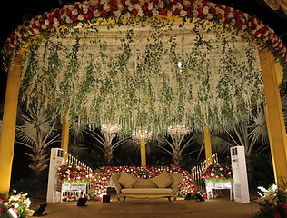 Green and white floral mandap decoration by Kauvery Events