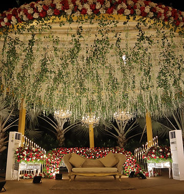 Floral jaimala stage with couple seating in Jammu