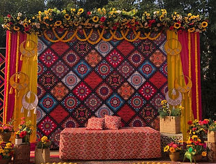 Colourful backdrop stage for a mehndi function by Kauvery Events