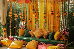 Yellow haldi function setup with umbrellas and floor seating