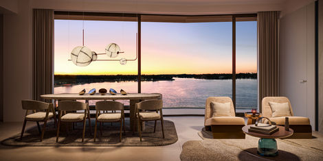 a living room with a view of a body of water