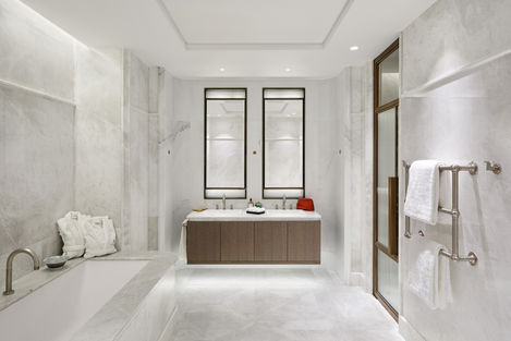 a bathroom with two sinks and two mirrors