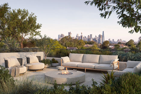 an artist 's impression of a patio with a couch and a fire pit