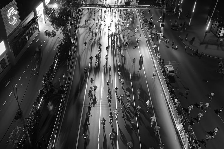 wixagency_a_birds_eye_view_of_people_running_a_night_marathon_edited.jpg