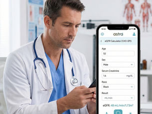 A male doctor wearing blue scrubs and a white coat sits in a bright clinical office, looking attentively at a smartphone in his hand. The phone screen clearly displays the AstraAI mobile app interface, featuring an active eGFR clinical calculator with input fields for age, sex, and serum creatinine levels.