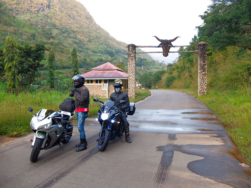 TWO BIKERS PACKED IN FRONT OF A NATURE RESERVE (GREEN, WHITE, BLACK AND SILVER)