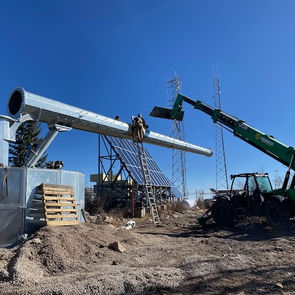 Attach pole sections and raise pole with ARE Hydraulic Ram system