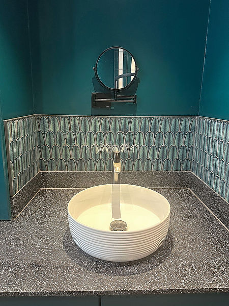A sink and shaving mirror.
