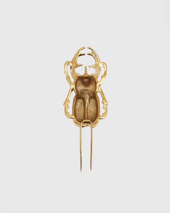Back view of the Surrealist Scarab  Brooch, showing the pin fastening and reverse construction of the piece.