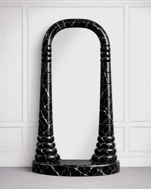 Front view of Standing Mirror No 2 in black marble, showing the broad arched frame and repeated rounded stone profiles.
Standing Mirror No 2, black marble, angled view