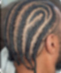 Intricate swirling men's cornrow braids