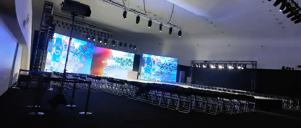 fashion show runway set up, stage, chairds and backdrop