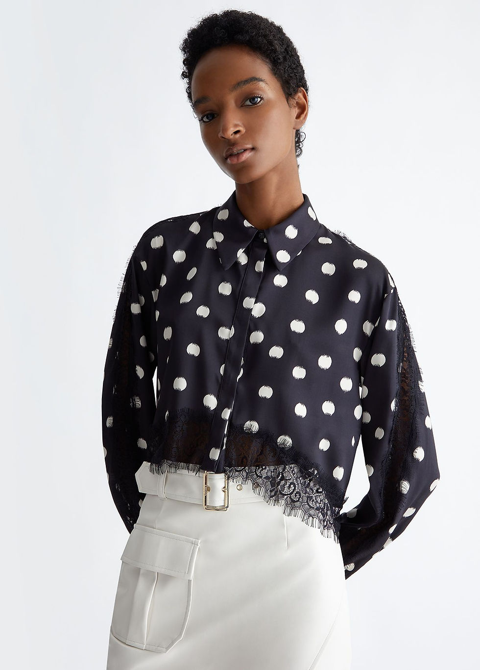 black and white polka dot blouse on a model.  design by liu-jo