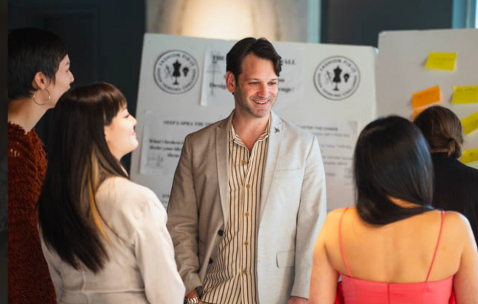 folks mingling at. a networking event by Inside Fashion Design