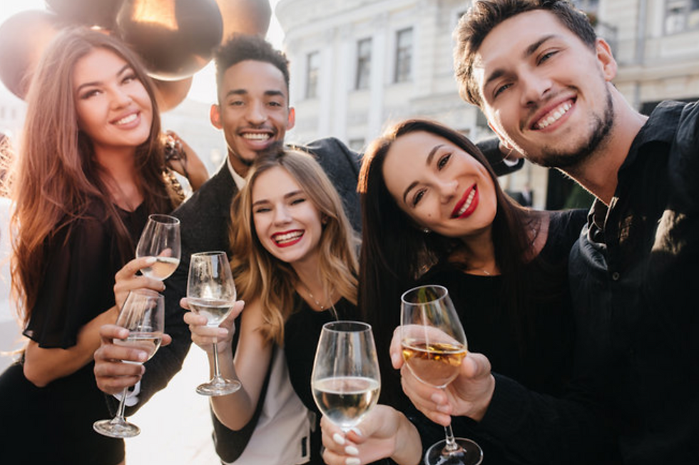 Group of friends with wine glasses at party