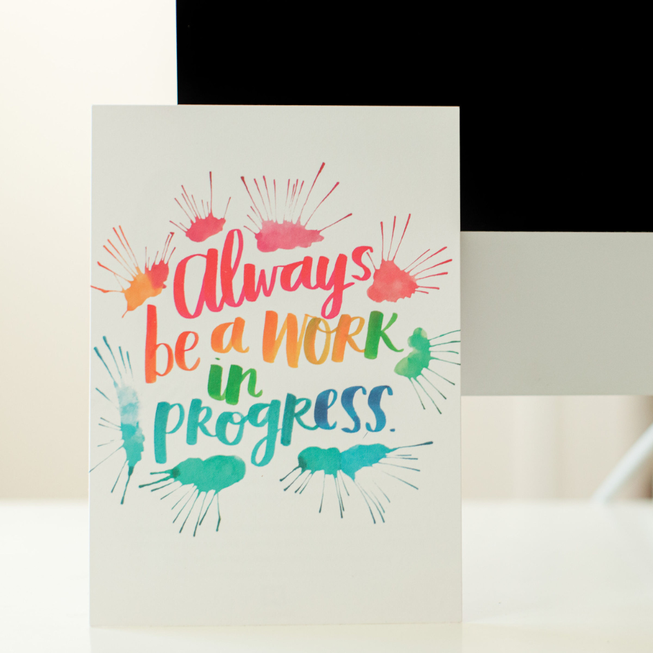 colorful sign that says "always be a work in progress"