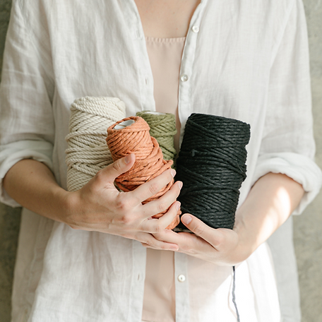 woman torso holding spools.png