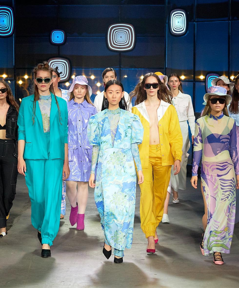 a group of models walking on runway