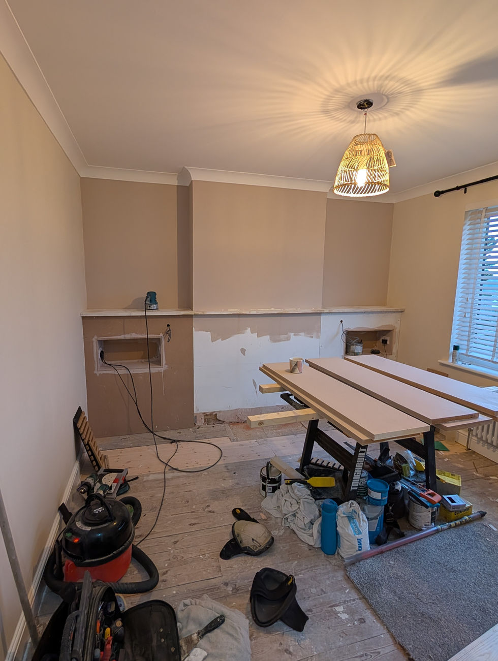 Handcrafting vertical oak slat panels for a modern feature wall.