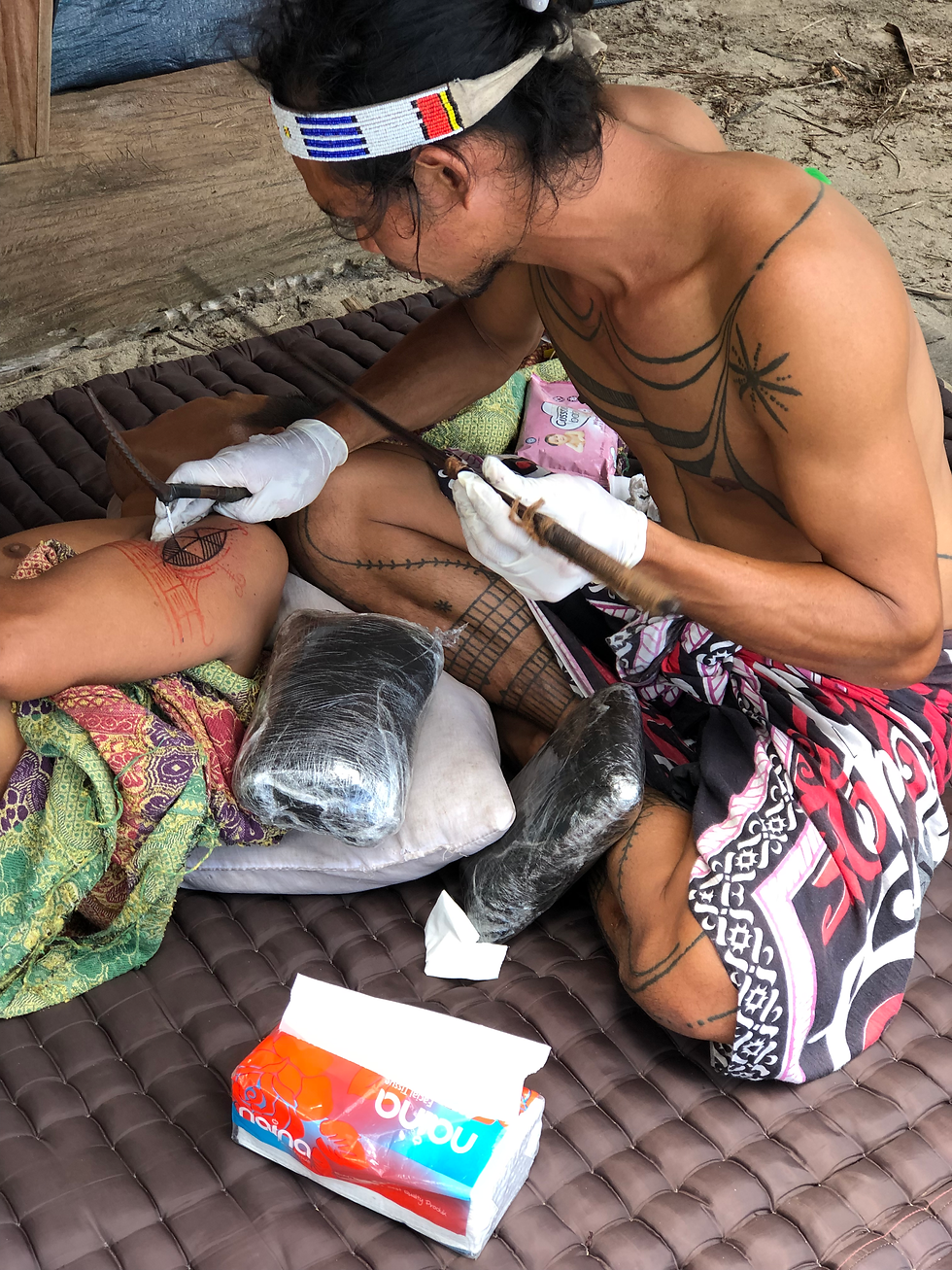 A local guy from Siberut island is doing tattoo