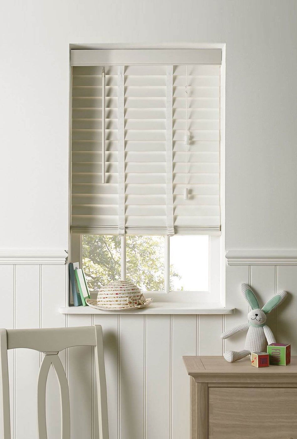 Classic Venetian blinds with horizontal slats, providing adjustable light control and privacy, while adding a sleek, timeless design to a modern interior.