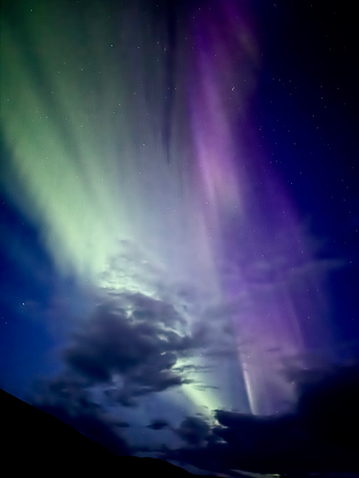 Northern Lights visible in the sky during the MeteoriteGong Creation Roadtrip in Iceland.
