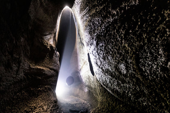 MeteoriteGong suspended and resonating inside a lava cave on Mount Etna in Sicily.