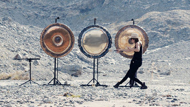 Pauline Fabry with the first nine MeteoriteGongs created at the Externsteine rock formation in Germany.