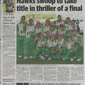 Champions of lawn bowling holding their trophies high in celebration