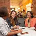 Four women working in a business meeting