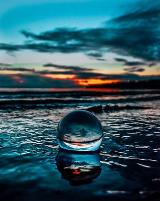 beach-clouds-glass-ball-1500121.jpg