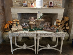 Single tier semi naked and dessert table on rustic wood stands