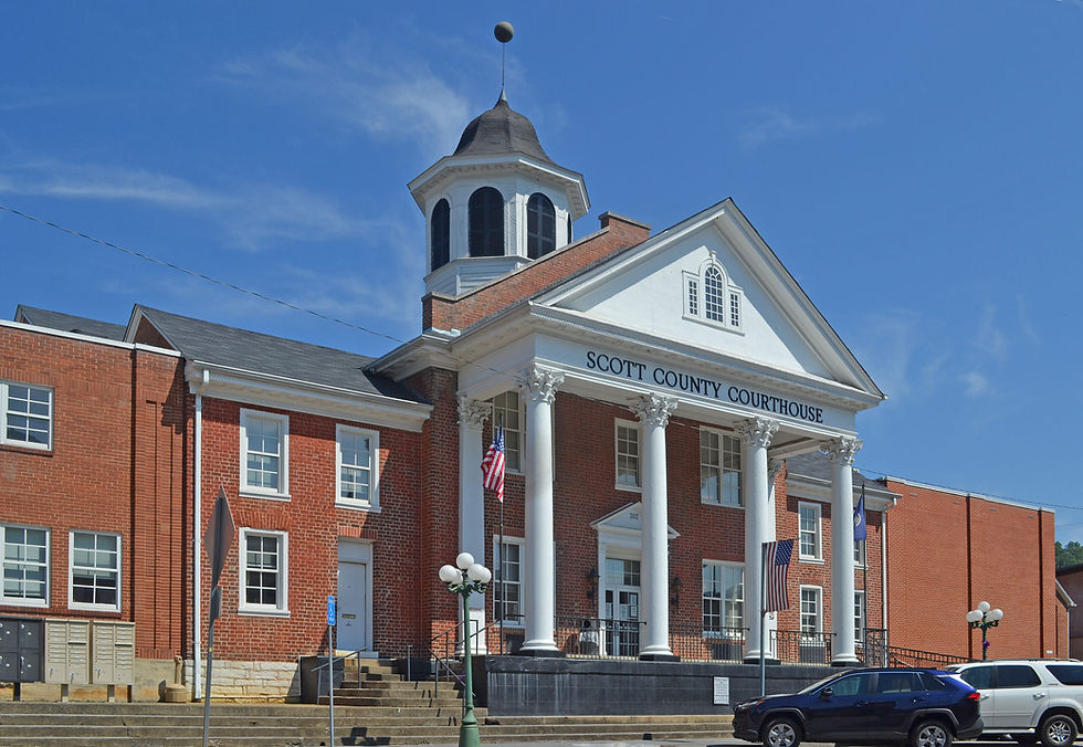 Wide-angle view of a rural county courthouse at dusk.