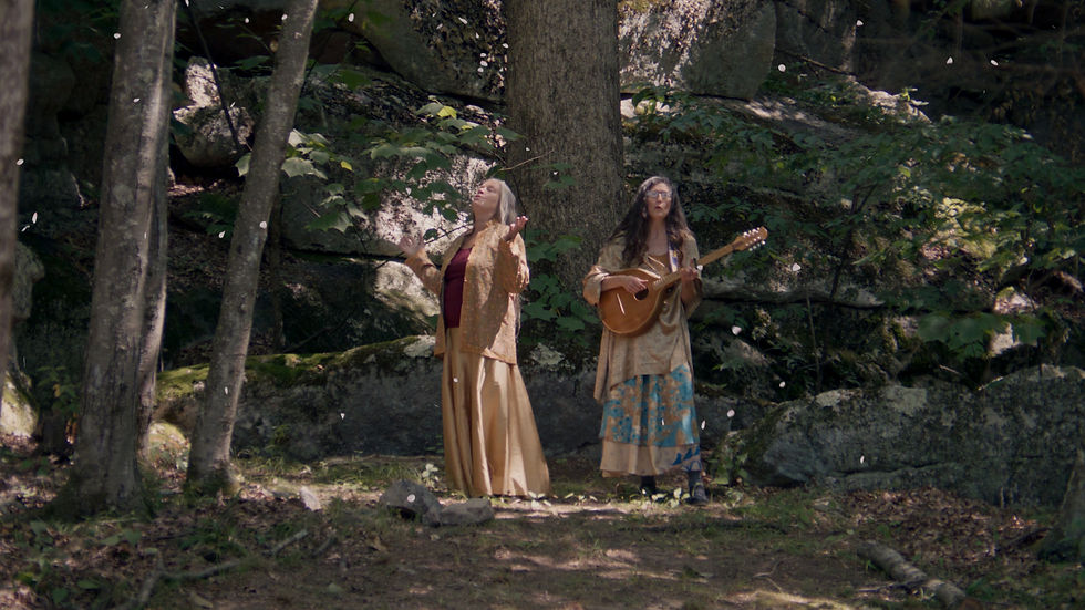 Exterior natural forest with hippie female leads singing by a New York City based Set Designer and Production Designer.