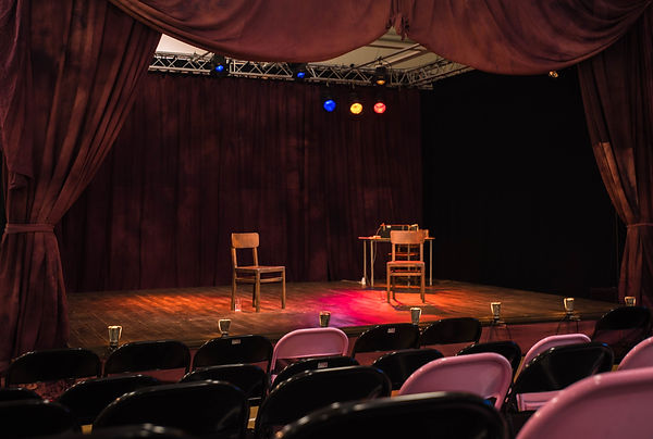 Theatre Deli Broadgate stage with two empty chairs