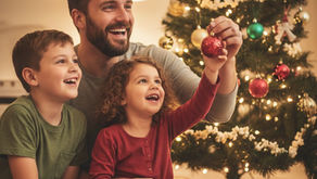 Father and his two children decorating their Christmas tree.